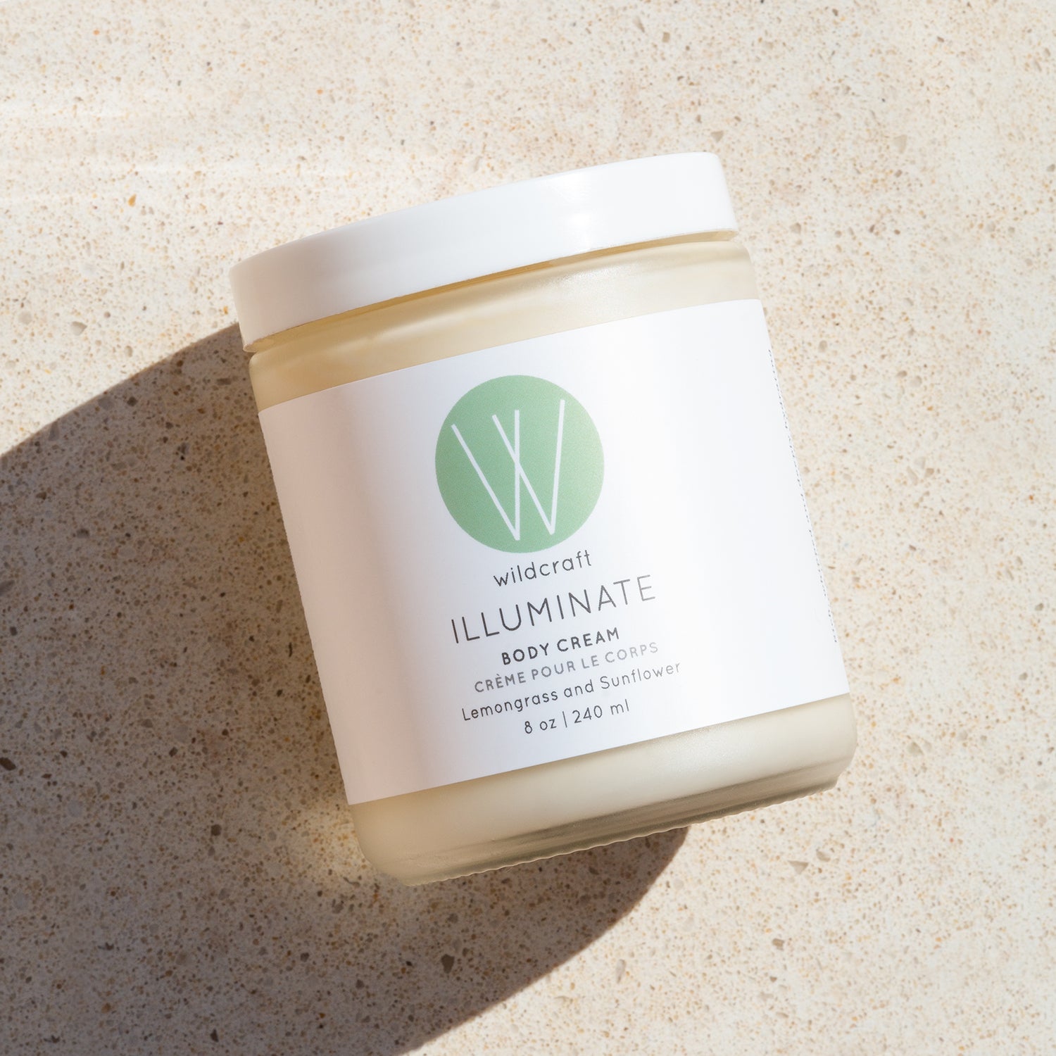 products/illuminate-body-cream-flatlay.jpg